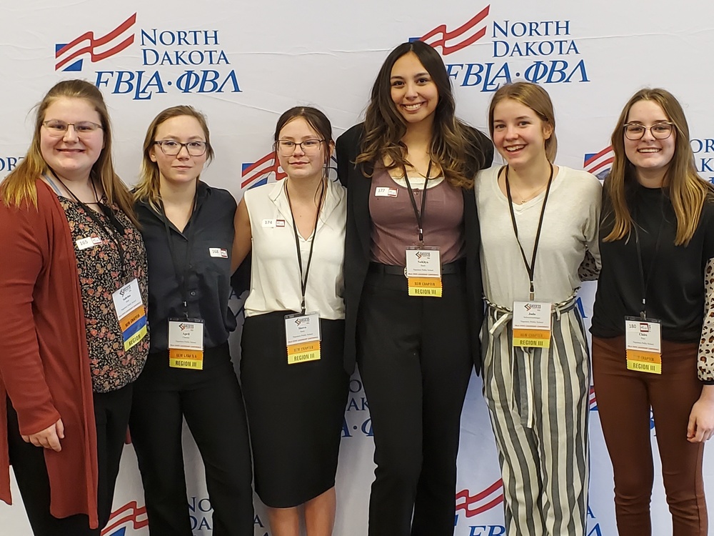 pic of girls attending conferenc