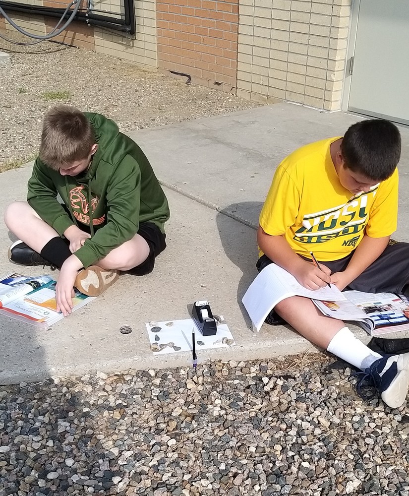 8th grade class completing first lab outdoors